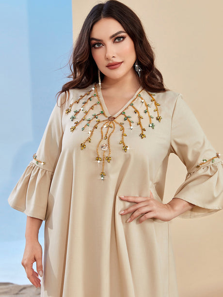 Loose glabiya in light beige color with medy frilly sleeves and embroidered front