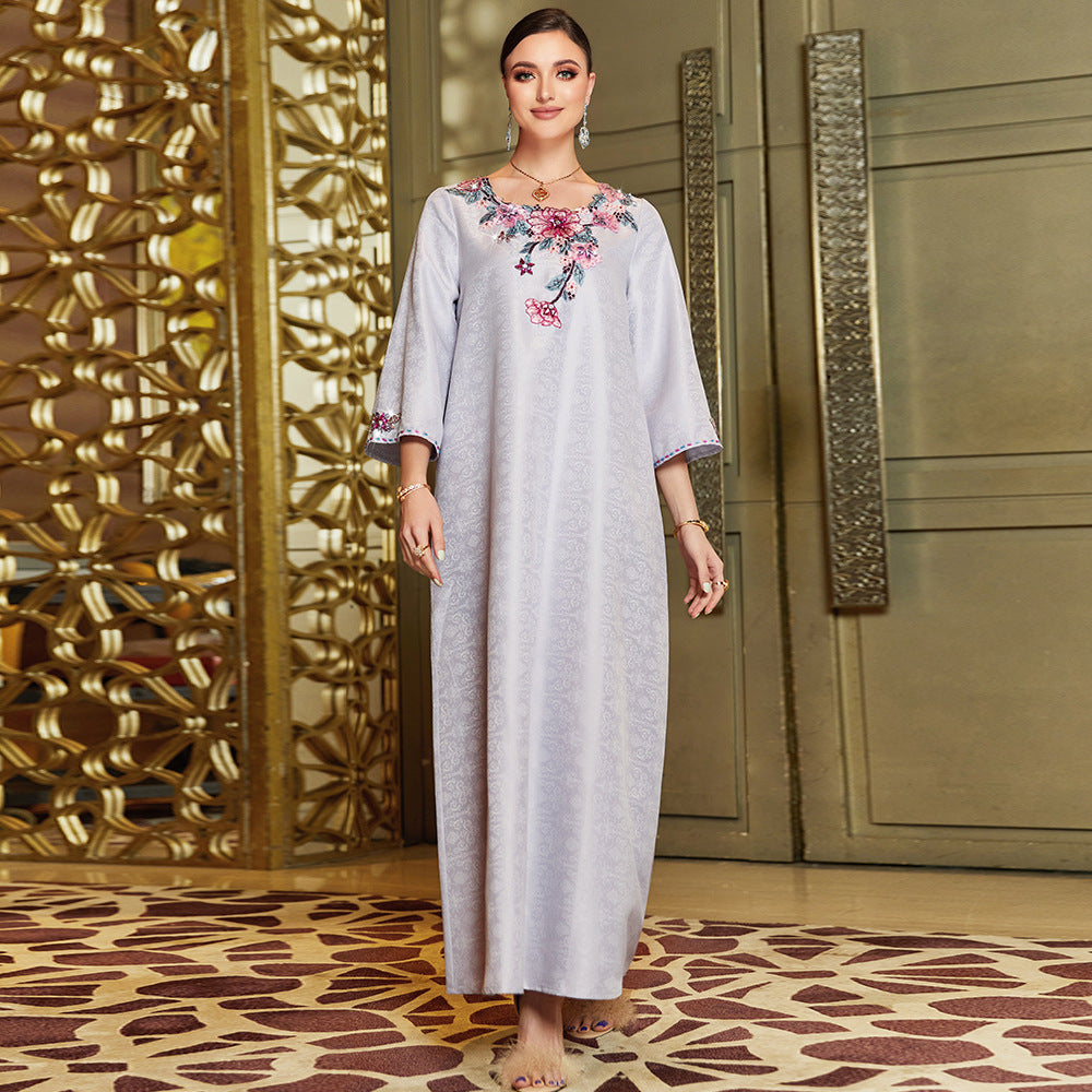 Loose glabiya in light lavender color with medy sleeves and embroidered rounded nick