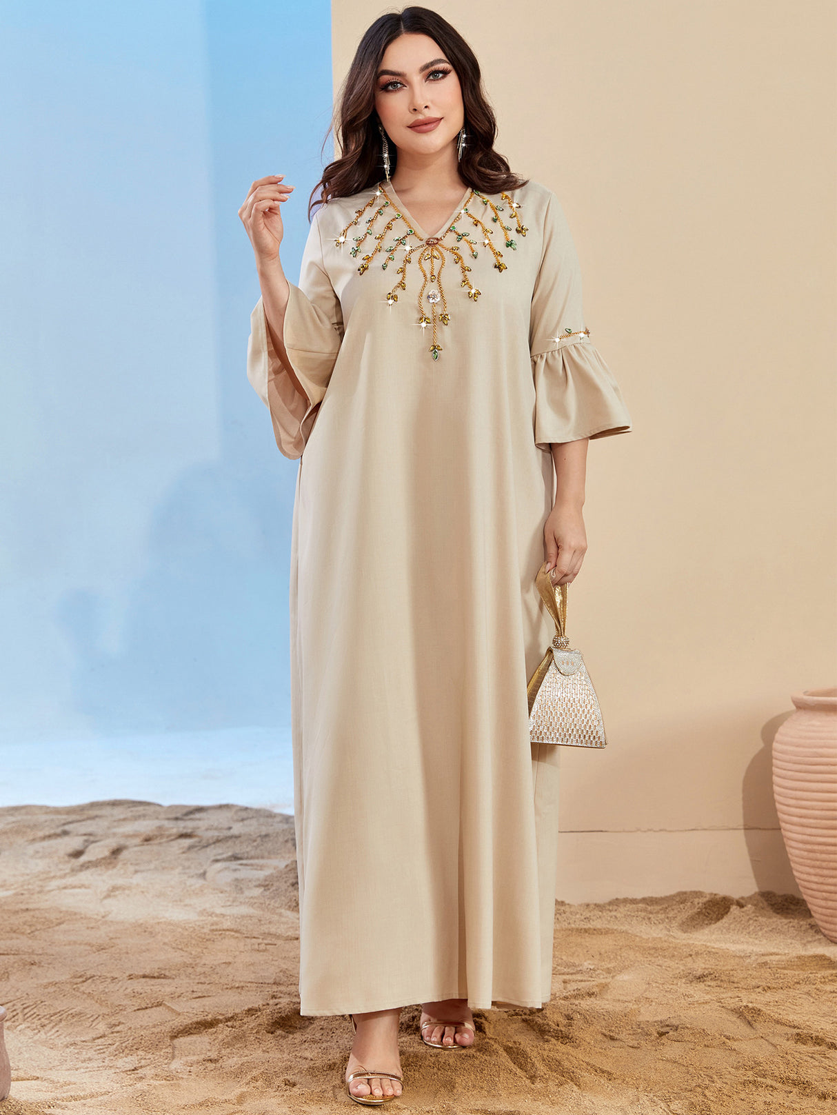 Loose glabiya in light beige color with medy frilly sleeves and embroidered front