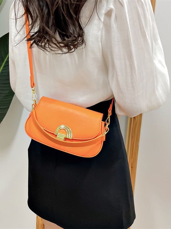 Solid color leather crossbody bag with gold lock button