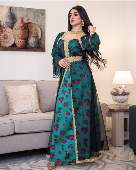 Jalabiya with a traditional design in a modern way, with a floral print, long sleeves, and a layer of black tulle