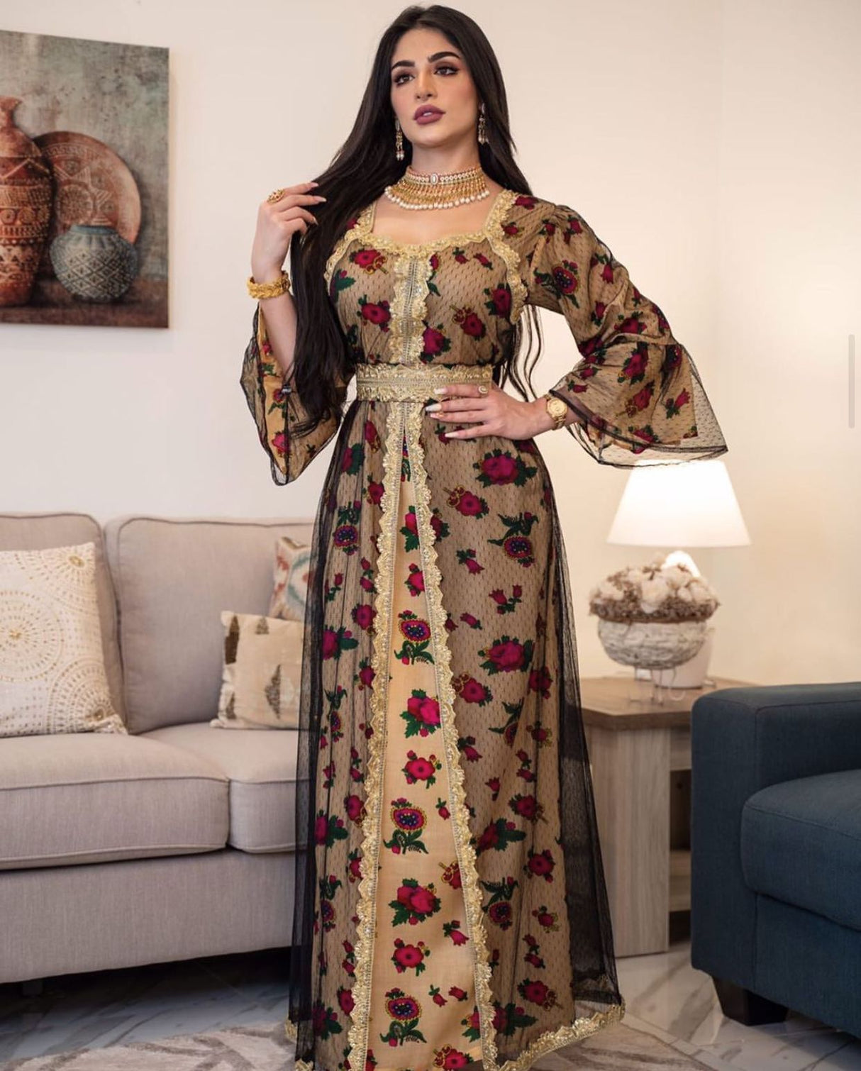 Jalabiya with a traditional design in a modern way, with a floral print, long sleeves, and a layer of black tulle