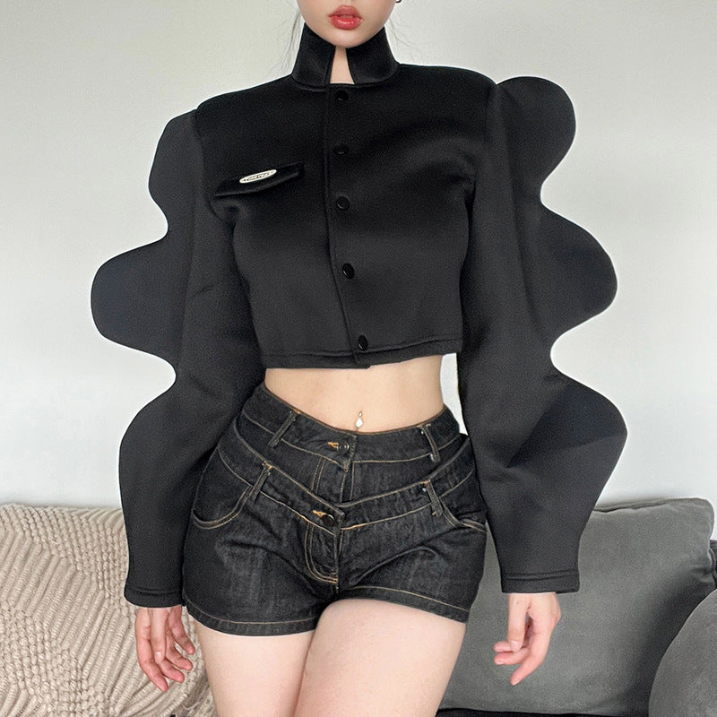 A bold black women's jacket with long curvy sleeves and front buttons