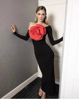 Women's black evening dress with long sleeves and a large red rose decoration