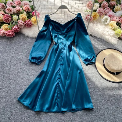 Solid color satin cloche dress with long puff sleeves, sweetheart neckline and buttons on the front