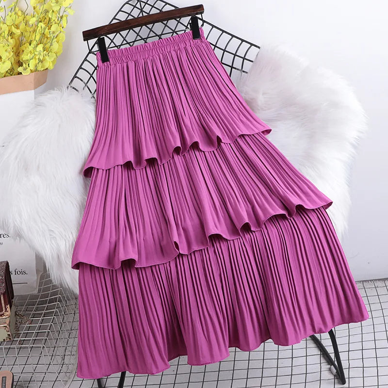 Three-layer pleated cloche skirt in solid color with internal elastic at the waist