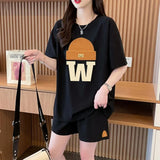 Women's set in solid color, wide T-shirt and wide shorts with drawstring, with hat and letter W print