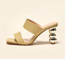 Leather sandal with a unique and distinctive golden heel