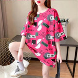 Wide T-shirt with elbow sleeves, solid color with random prints in the form of squares, circles, semicircles and writings