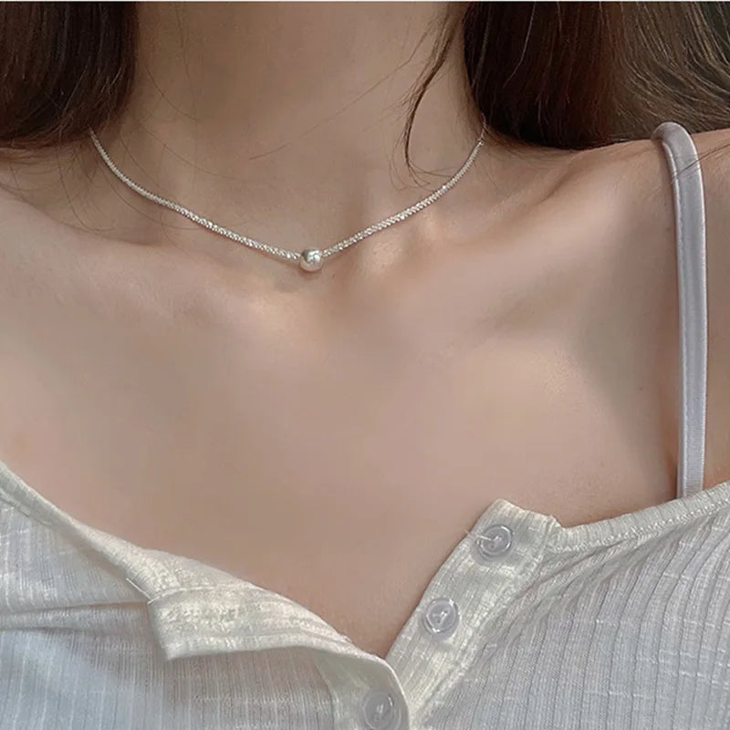 A short necklace with an elegant small ball