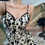 Women's white summer dress decorated with black roses