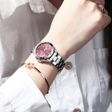 Luxury waterproof women's watch with an elegant style, a silver stainless steel case with a pink base