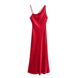 A soft, silky red dress with one shoulder and a delicate rope for the other shoulder