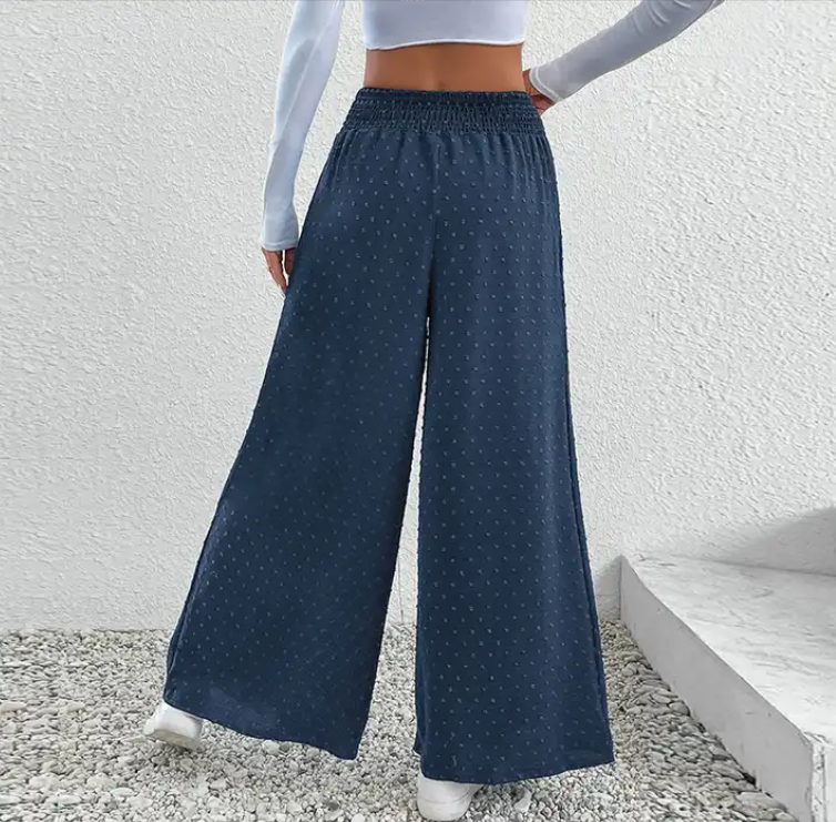 Long trousers with a wide, elastic waist and straight cut