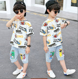 Boys' two-piece set, light-colored denim shorts with front pockets and a comic-print T-shirt