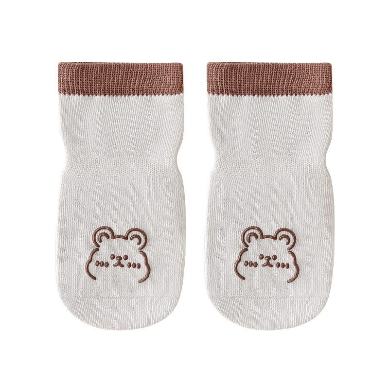 A pair of baby socks with non-slip design in a cute design