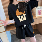 Women's set in solid color, wide T-shirt and wide shorts with drawstring, with hat and letter W print