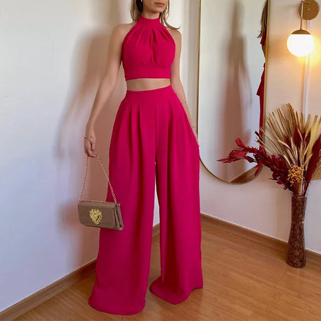 An elegant two-piece set for women, a sleeveless crop top and wide, high-waisted pants in a solid color