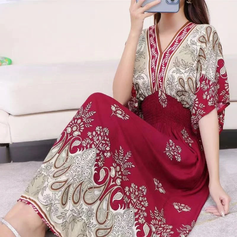A long home robe with an elegant design, random patterns, medium-length sleeves and a tight waist