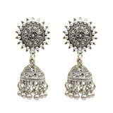 Bohemian style silver colored earrings with a circle shape, a small dome, and small hanging bells