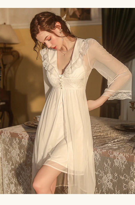 white sleep wear in tow pieces , short dress and midi robe with long sleeves , front buttons and wide colar