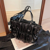 A practical and elegant large patent leather shoulder bag with wrinkles and ruffles