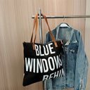 Large printed shoulder bag `BLUE WINDOWS BEHIN`