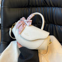 Fashionable leather handbag with shoulder strap