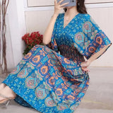 A long home robe with an elegant design, random patterns, medium-length sleeves and a tight waist