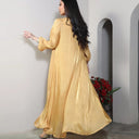 A two-piece set of a long, solid-colored, sleeveless dress and an elegant abaya in the same color