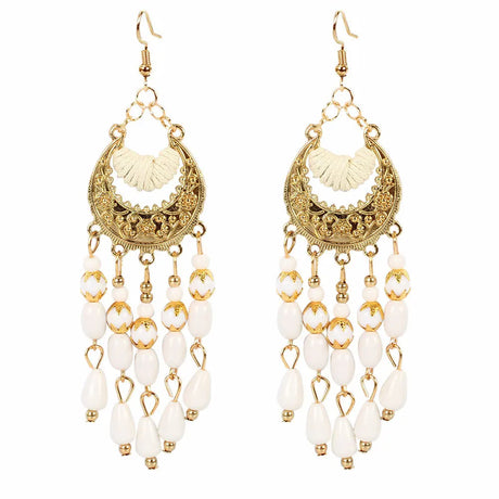 Women's gold embroidered dangling earrings decorated with beads and colored rhinestone