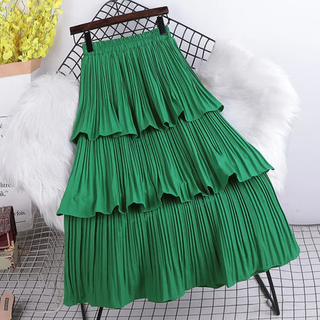 Three-layer pleated cloche skirt in solid color with internal elastic at the waist