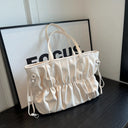 A practical and elegant large patent leather shoulder bag with wrinkles and ruffles
