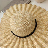 Straw hat with waves and bow