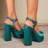 Women's sandal made of silk with a thick, large, high heel in the shape of a fish mouth In turquoise green with an ankle strap