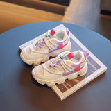 Girls' walking sports shoes with an elegant design with interlaced patterns in pink and purple, with a lace-up front