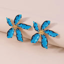 A wonderful summer earring in the shape of a dotted flower decorated in gold