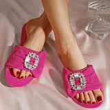 Modern women's slippers with a distinctive color and a large silver buckle .Suede