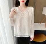 Women's off-white top dress with long bell sleeves, decorated with pearls