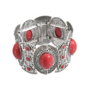Women's wide bohemian silver colored bracelet decorated with colored stones, equipped with rubber