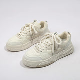 Women's casual sneakers in white with overlapping colored stripes and a front lace-up