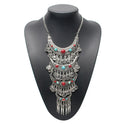A popular style necklace with four layers decorated with turquoise and red stones with dangling pennies