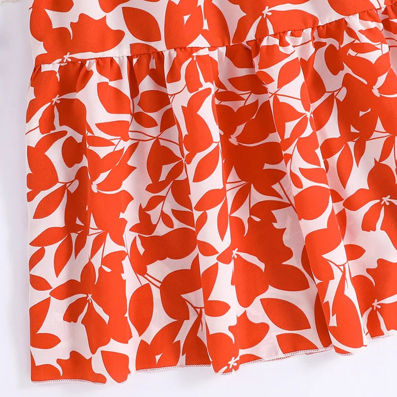 Girls' sleeveless summer dress with orange leaf patterns