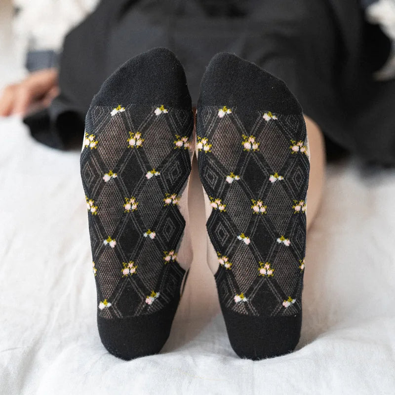 A set of light, short, and transparent home socks with cute floral patterns