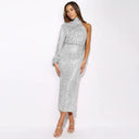 Sequin dress with one lantern sleeve and round neck. Polyester/Spandex