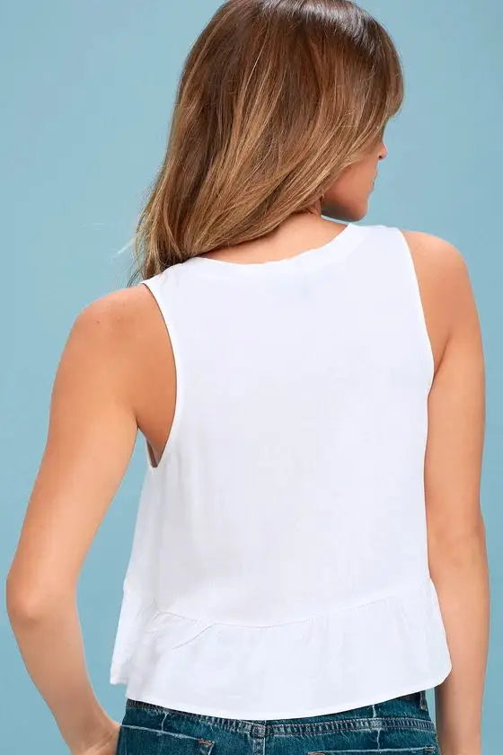 Sleeveless top with a triangle chest opening and a ruffled hem