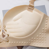 Push-up bra with drawstrings at the front, clips at the back and internal massaging supports