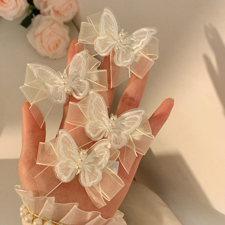 Set of two butterfly clips with transparent white ribbons