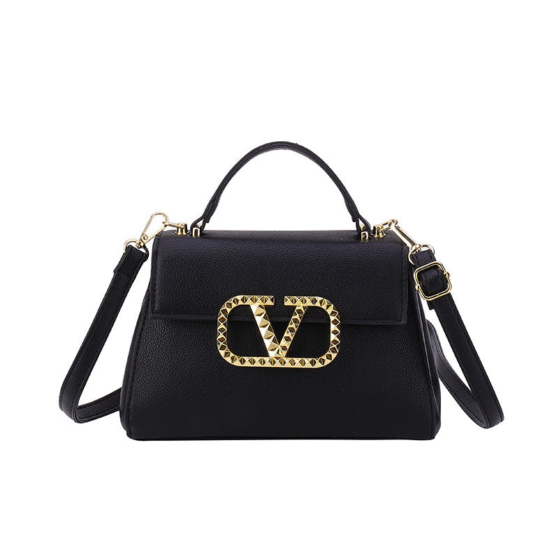 Small solid-color leather crossbody bag with an elegant gold V-button closure