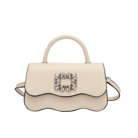 Small handbag in patent leather with a wavy base and crystals arranged in a rectangular shape